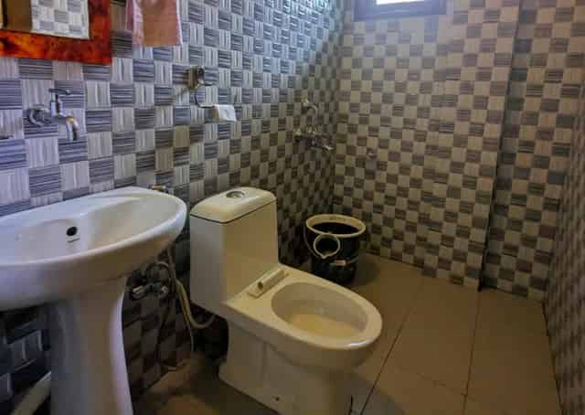 Washroom at Mawlynnong Guest Inn