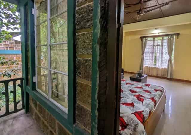 Room interior at Mawlynnong Guest Inn