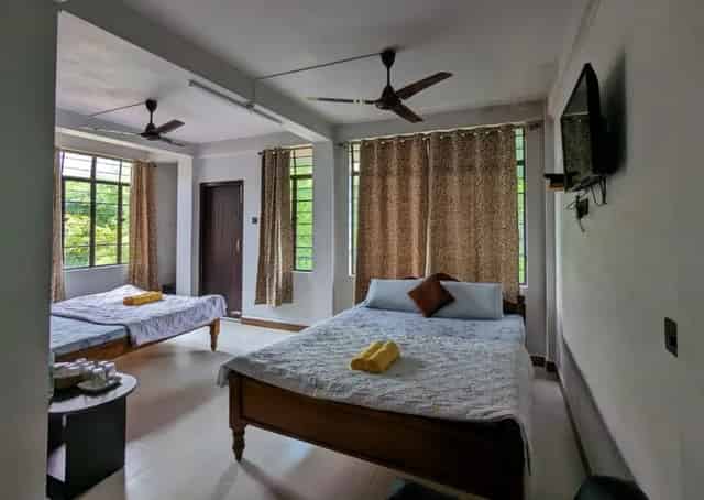Room interior at Mawlynnong Guest Inn