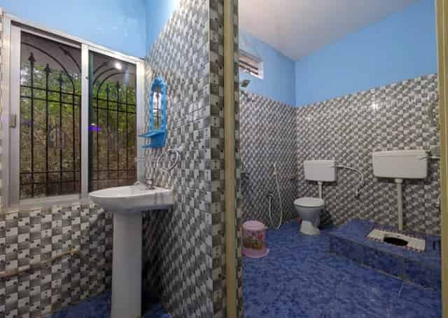 Washroom at Daringbadi Guest Inn