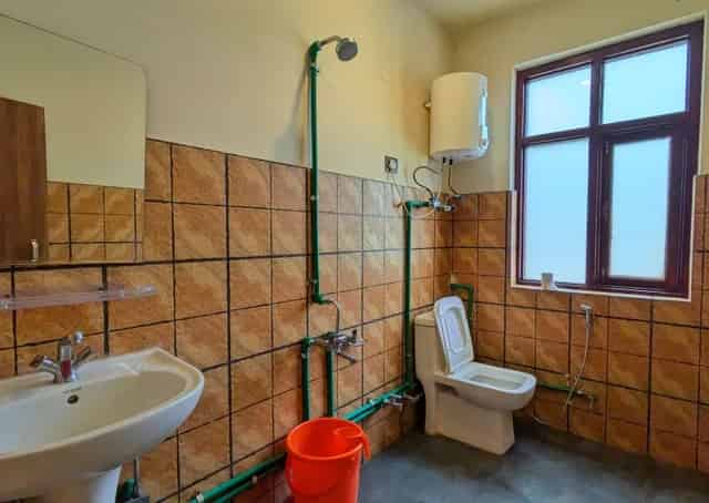 Western washroom for Dormitory Room with bunk beds at  Jispa Guest Inn