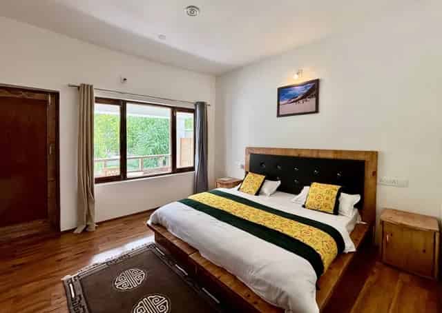 Luxury room with balcony interior at Diskit Retreat