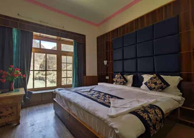 With Balcony Deluxe Room Interior at Aryan Valley Retreat