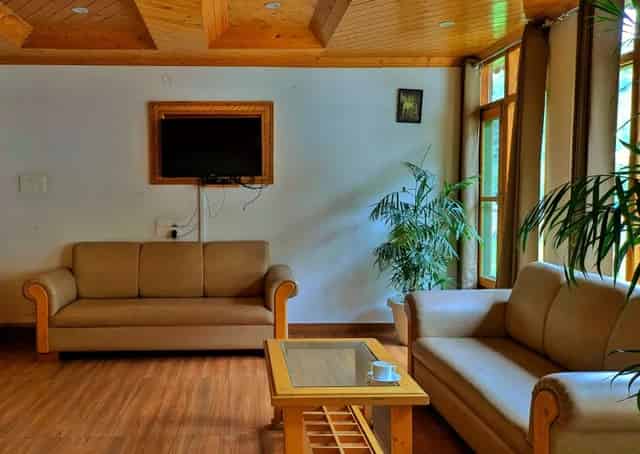 Common seating area at Kullu Retreat