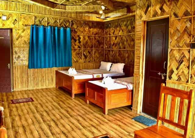 Triple beded bamboo cottage interior of Baranti Eco Stay