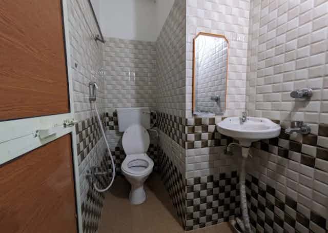 Washroom at Daringbadi Guest Inn