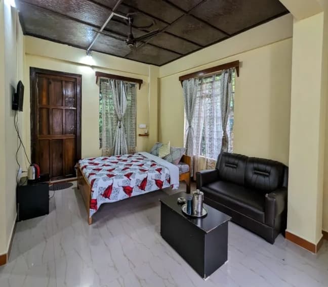 Room interior at Mawlynnong Guest Inn