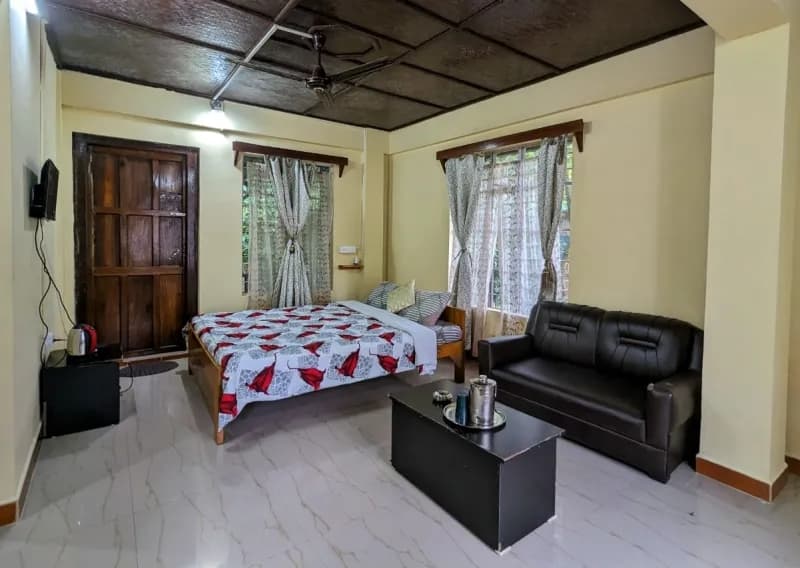 Room interior at Mawlynnong Guest Inn