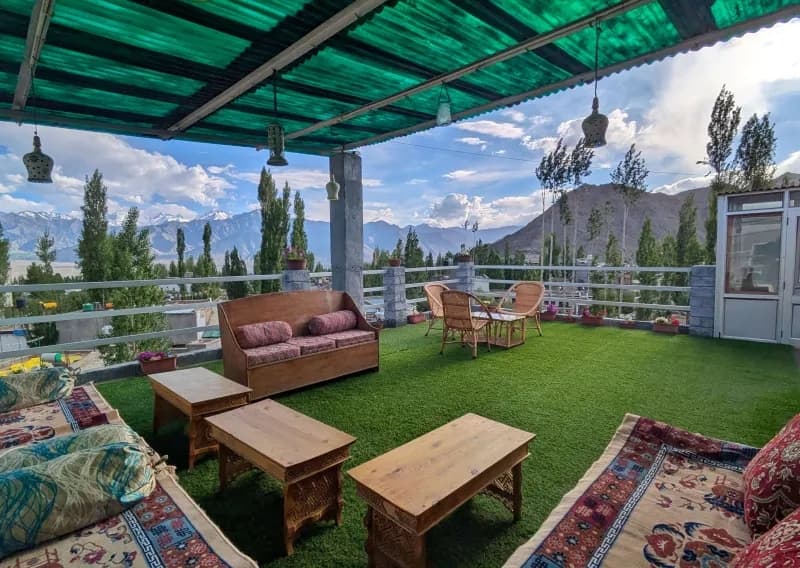 Rooftop seating area at Leh Retreat